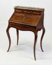 A circa 1900 French mahogany and brass inlaid bureau-de-dame, having a three drawer raised