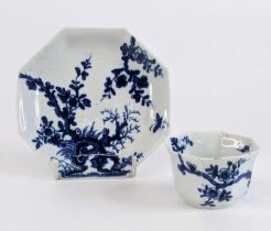 A Worcester porcelain tea bowl and saucer, circa 1755, of octagonal form, each decorated in the '