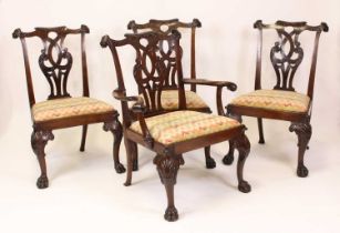 A set of eight mahogany dining chairs in the Chippendale taste, circa 1900, each having swept