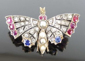 A late Victorian yellow and white metal multi-stone butterfly brooch, comprising 28 rose cut