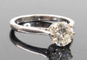 A white metal diamond solitaire ring, featuring a round brilliant cut diamond in eight-claw setting,