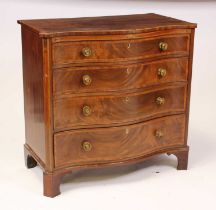 A George III mahogany chest of serpentine outline, having four long graduated and satin wood cross