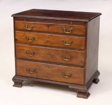 An early George III mahogany chest, the top having a thumb moulded edge above a brushing slide and