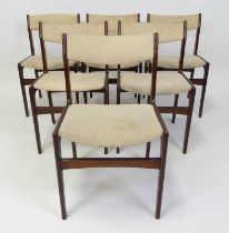 A set of six 1960s Danish rosewood barback dining chairs, having cream suede backs and fixed pad