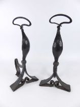 Believed Glasgow School of Art for Liberty - a pair of wrought iron fire-dogs, deep patinated and of