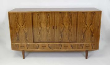 A 1960s Danish rosewood Megalith sideboard, having four sliding upper cupboard doors, enclosing