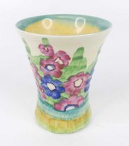 A 1930s Clarice Cliff small floral decorated pottery vase, of ribbed waisted form, typically