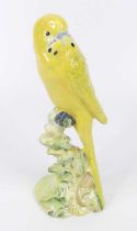 A Beswick pottery yellow budgerigar, facing left, underglaze painted, printed backstamp and