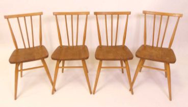 A set of four 1960s Ercol blond elm model 391 stickback kitchen chairs, raised on turned slightly