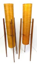 A pair of 1960s teak and fiberglass 'rocket' floor lamps, each of elongated tapering form, h.112.5cm