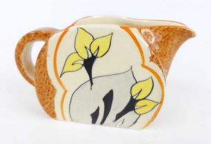 A 1930s Clarice Cliff Cowslip (Brown) pattern pottery cream jug, in the Bonjour shape, bright colour