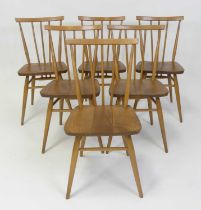 A set of six 1960s Ercol blond elm model 391 stickback kitchen chairs, raised on turned slightly