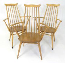 A set of three 1960s Ercol blond elm 'Goldsmith Windsor' elbow dining chairs, model No. 369A, raised