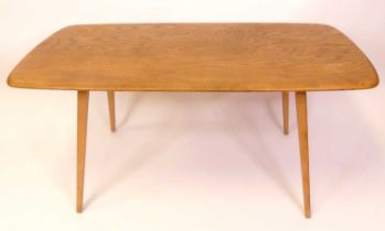 A 1960s Ercol blond elm Windsor model 382 dining table, having rounded corners, on square tapering