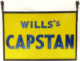 A vintage Wills's Capstan reverse printed glass hanging advertising sign, with black painted iron