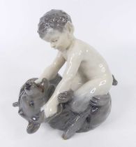 A Royal Copenhagen glazed porcelain figure of a faun wrestling a bear, printed marks verso and