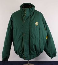 Formula 1 interest, a Lotus Team jacket, circa 1990s, in green with yellow trim, signed by various