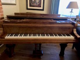 A 19th century burr walnut cased grand piano by Ronisch of Germany, the overstrung iron frame marked