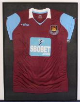 A West Ham replica first team shirt signed by members of the squad circa 2008/09 season, framed