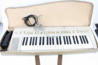 A Yamaha model PP-1 electric keyboard, in Yamaha carry case with pedal, tubular chrome stand and a