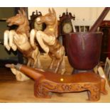 A pair of contemporary carved teak model rearing horses; together with an oversized pestle and
