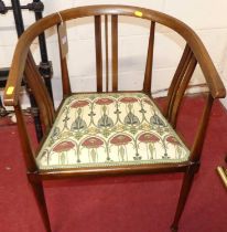 An Art Nouveau mahogany and chequer inlaid tub elbow chair, having a stylised floral needlework