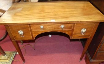 A 19th century mahogany kneehole three-drawer low boy, on square tapering supports to castors, width