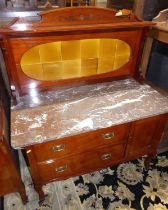 An Edwardian walnut variegated marble topped and tiled inset wash stand, having twin drawers and