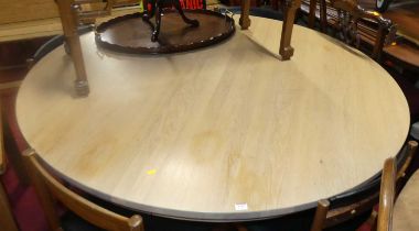 A contemporary Neptune blond oak circular breakfast table, raised on pedestal base, dia.150cm A