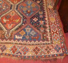 A Persian woollen red and blue ground Heriz rug, 195 x 134cm Some fading and light discolouration.