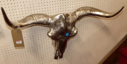 A pair of contemporary polished metal buffalo horns, w.67cm