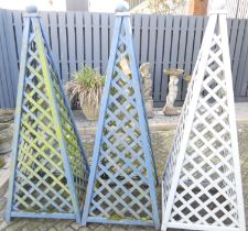 Three painted garden timber obelisks, each h.182cm