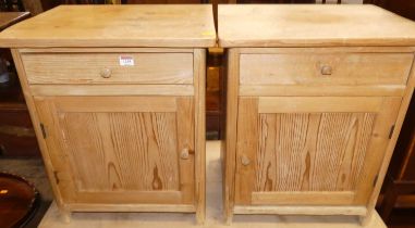 A pair of rustic pine single door bedside cabinets, each with single upper drawers, width 48.5cm