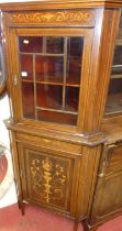 An Edwardian mahogany and floral satinwood inlaid corner cabinet, having glazed upper door over