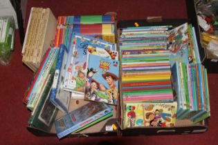 Two boxes containing various childrens annuals to include Disney, Pixar Toy Story 2, Disney