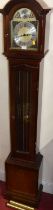 A reproduction mahogany grandmother clock, having an arched brass and silvered Tempus Fugit dial,