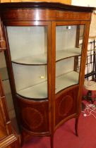 An Edwardian mahogany, satinwood inlaid and further strung single door glazed china display cabinet,