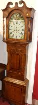 An early 19th century provincial oak and mahogany longcase clock, the painted arched dial signed J&T