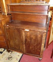 A George IV mahogany chiffonier, having two-tier open superstructure over twin cupboard doors to