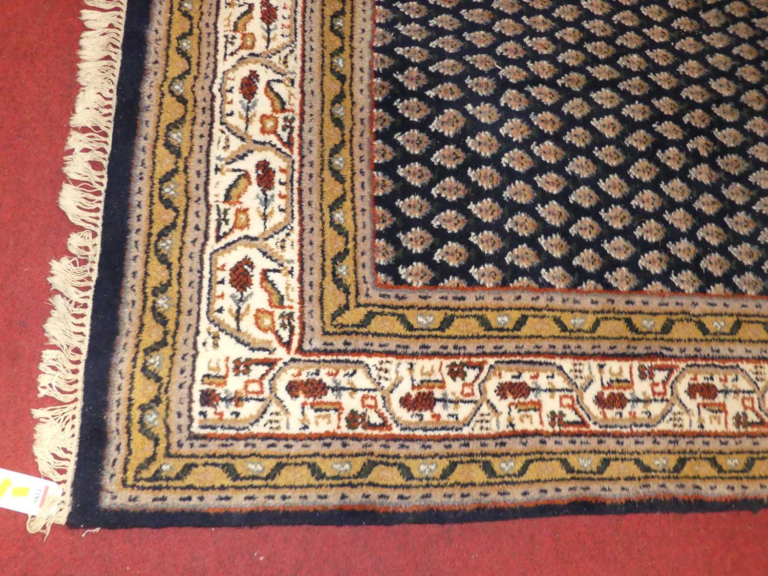 A Persian woollen blue ground Bokhara rug, the central floral repeating ground within trailing - Image 2 of 3