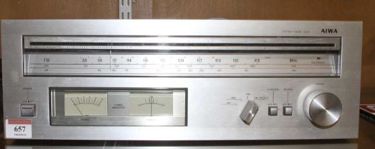 An Aiwa 9300 Stereo Tuner, Model No. AT-9300K, circa 1979, w.42, d.26.5, h.14cm, together with a