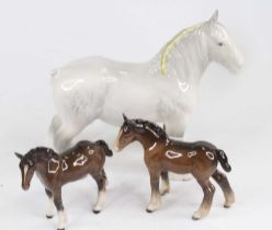 A Beswick model of a Shire horse, model No. 818, h.21cm; together with a pair of brown gloss ponies,