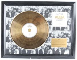 Abba, a gold presentation disc for the compilation album More Abba Gold, mounted with a CD sleeve