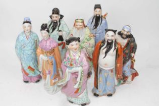 A set of Chinese pottery figures of the eight Immortals, h.31cm One broken at the neck and glued.