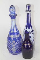 A 19th century Bohemian blue opaline overlaid glass decanter and stopper, of mallet shape, h.33cm;