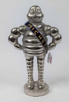 A polished metal figure of the Michelin Man, h.37cm
