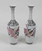 A pair of Japanese eggshell porcelain vases, painted with birds amongst flowers, h.26cm