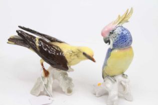 A Karl Ens porcelain model of a parrot, h.20cm; together with a Goebels model of a bird, h.12cm (