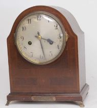 An early 20th century walnut and inlaid dome top mantel clock, the silvered dial with Arabic markers