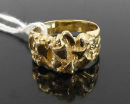 A yellow metal carved gold band ring, stamped 14k and tests as approx 14ct gold, 6.3g, size P